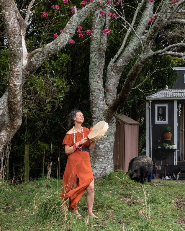 Brand portrait of Karin Vincent from Tea & Happiness Rotorua in front of her tiny home