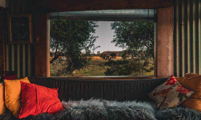 Unwind in Northland accommodation | Tucked in an olive grove, relax in a hammock outdoors