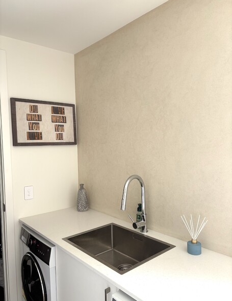 Micro cement laundry walls finished by the team at Pro Stop Interiors Queenstown.