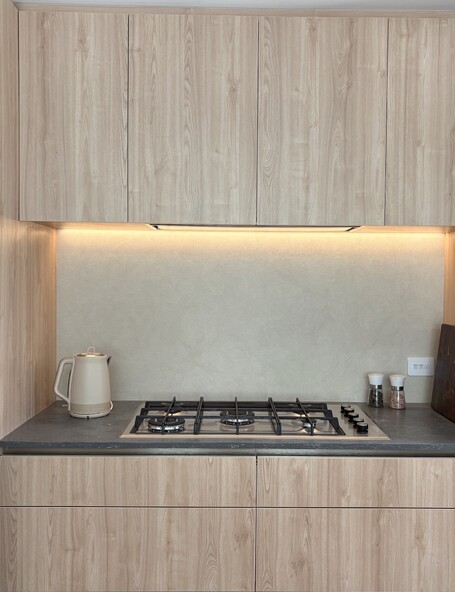 A custom microcement splashback created by the team at Pro Stop Interiors Queenstown