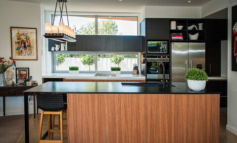 Custom joinery in the Highfield kitchen, featuring two-tone cabinetry and practical storage.