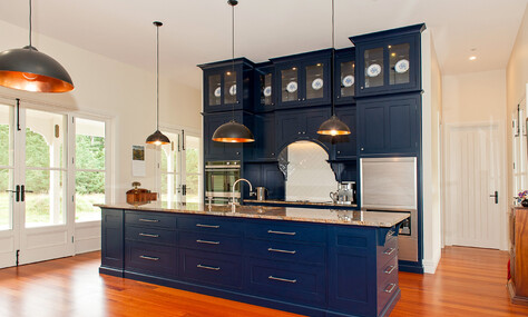 Timber accents in the kitchen, adding warmth and sophistication by Barrett Joinery.