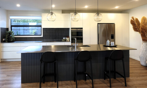 Central island with seating, adding practicality to the modern kitchen by kitchen designer Timaru.