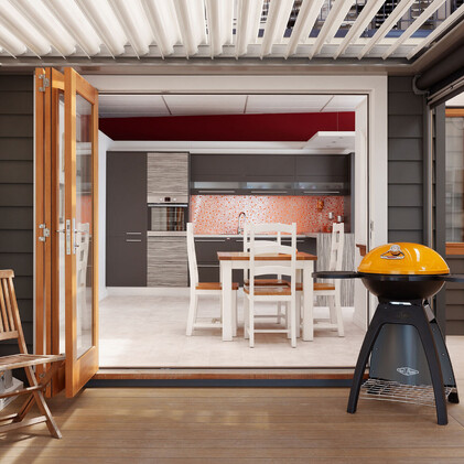 Modern kitchen in Barrett Joinery's Timaru showroom featuring custom cabinetry, bold orange backsplash, and innovative storage solutions, showcasing bespoke joinery for contemporary homes.