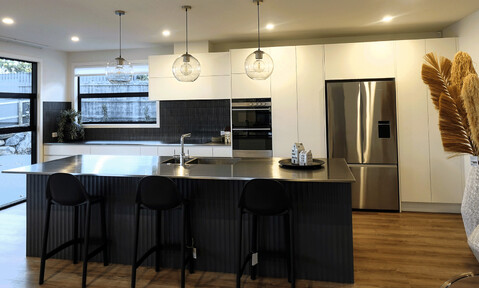 Full kitchen view of the Lazarette kitchen, showcasing open-plan design and craftsmanship.