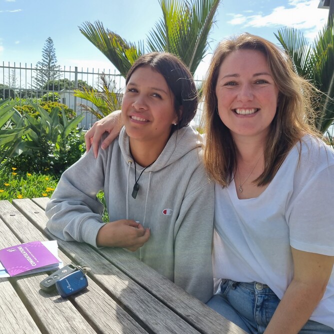 Alex and Jaezahn smiling as they celebrate their five-year match anniversary at Lick This!