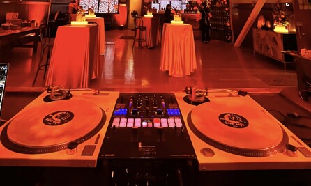 Corporate themed event with DJ using turntables
