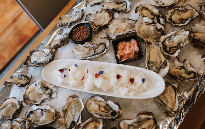 Oysters with edible citrus pearls and granita of yuzu gin and elderflower