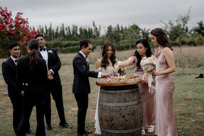 wedding couple and guests enjoying canapés