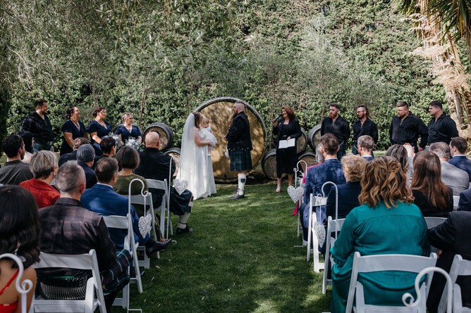 Summer wedding ceremony at The Barrels at Markovina Estate in Kumeu