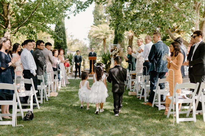 Kids walking down the Aisle during the wedding ceremony at Markovina Estate in Kumeu