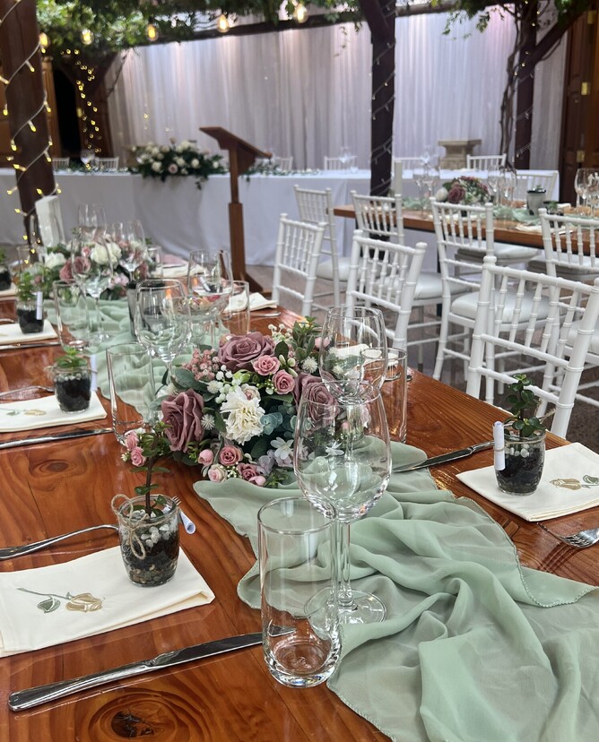 wedding table with plant wedding favors on top