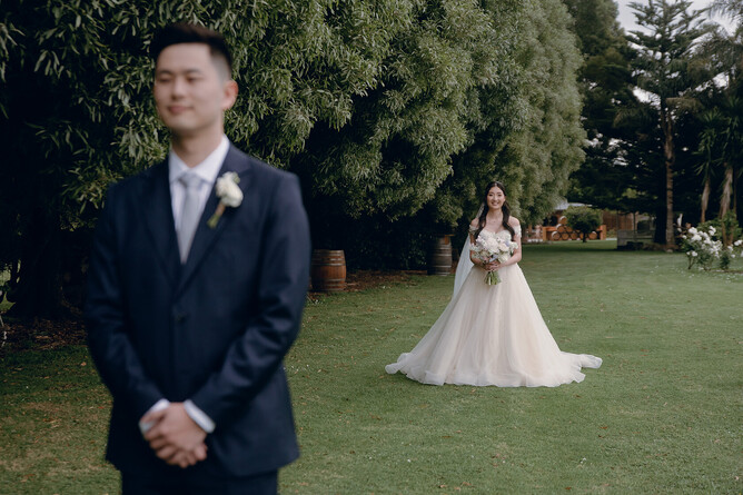 cinematic shot of bride and groom outdoors