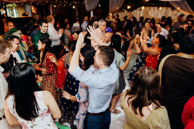 Guests dancing during the wedding reception at Markovina Vineyard Estate in Kumeu