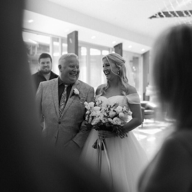 Sarah walking down the aisle with her father