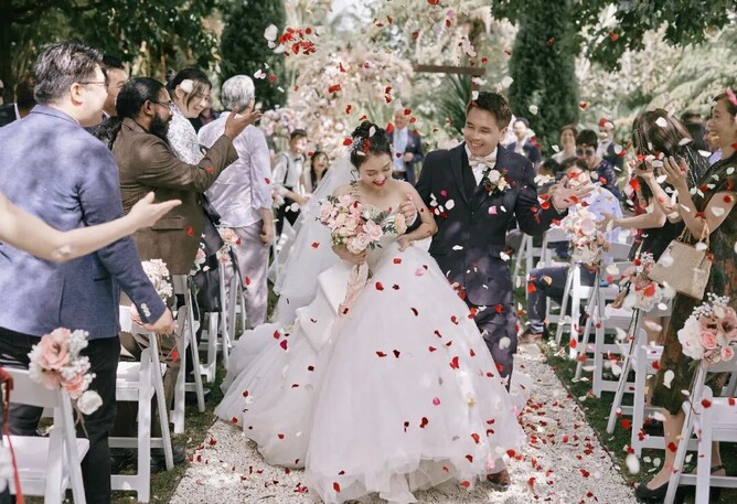 Bride & Groom walking down the aisle at the end of their wedding ceremony at the Barrel Waterfall at Markovina Estate in Kumeu, Auckland