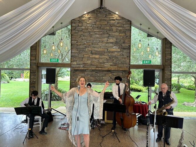 Wedding band playing during the cocktail hour at Markovina Estate in Kumeu