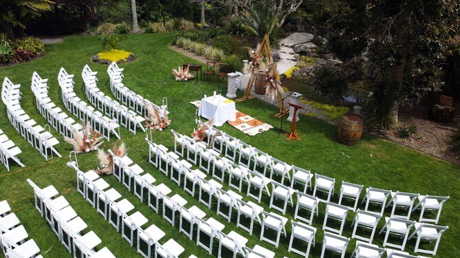 Wedding ceremony setup at the Pebble Beach at Markovina Estate in Kumeu