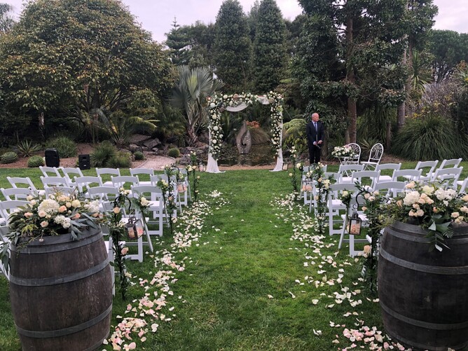 Wedding ceremony setup at the Pebble Beach at Markovina Estate in Kumeu