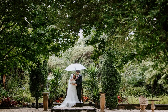 Bride & groom in greenery and gardens at Markovina Vineyard Estate in Kumeu