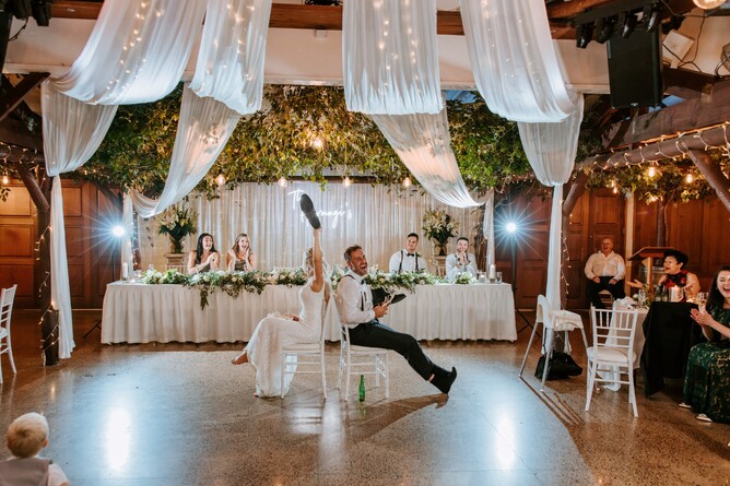 Wedding couple playing Mr & Mrs game during the reception at Markovina Estate in Kumeu