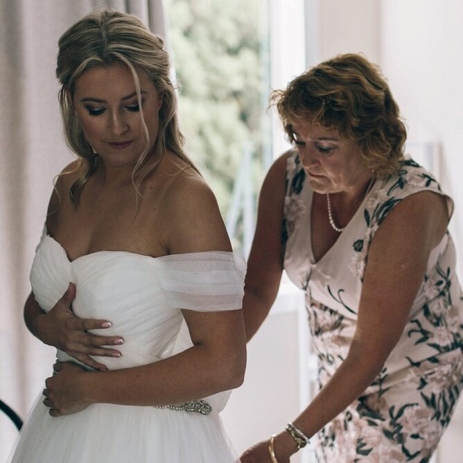 Sarah getting her dress fixed