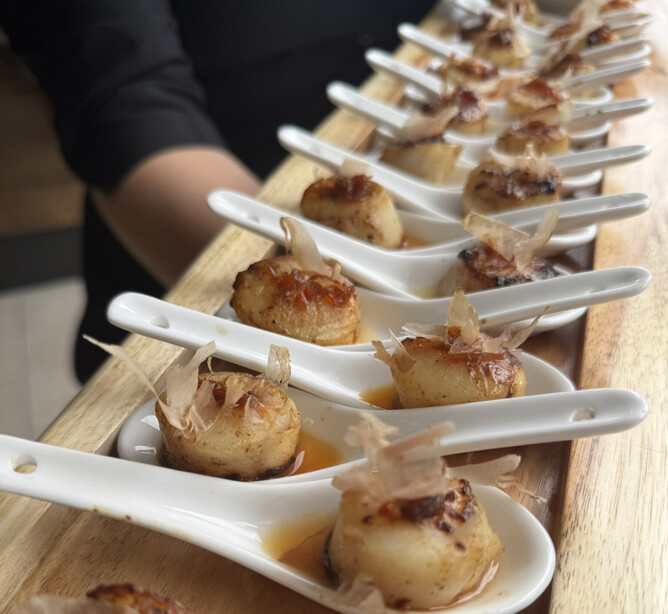 Scallops with XO sauce served in a chinese spoon