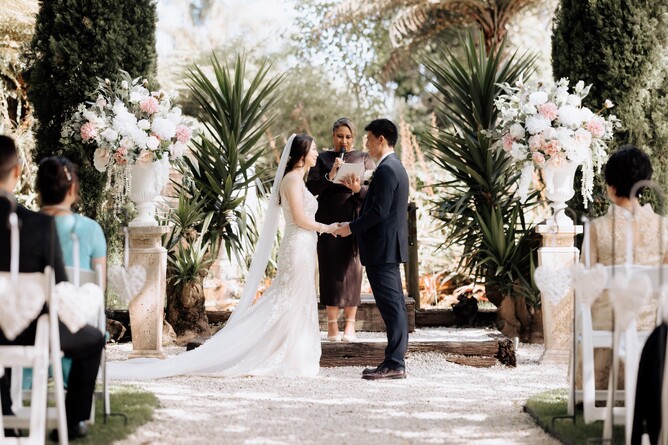 Stunning Wedding Ceremony setup with florals at the Barrel Waterfall at Markovina Estate in Kumeu