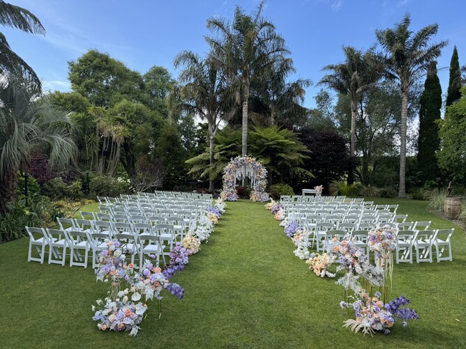 Wedding ceremony setup at The Palms at Markovina Estate in Kumeu