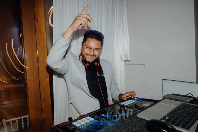 DJ playing music during the wedding reception at Markovina Estate in Kumeu