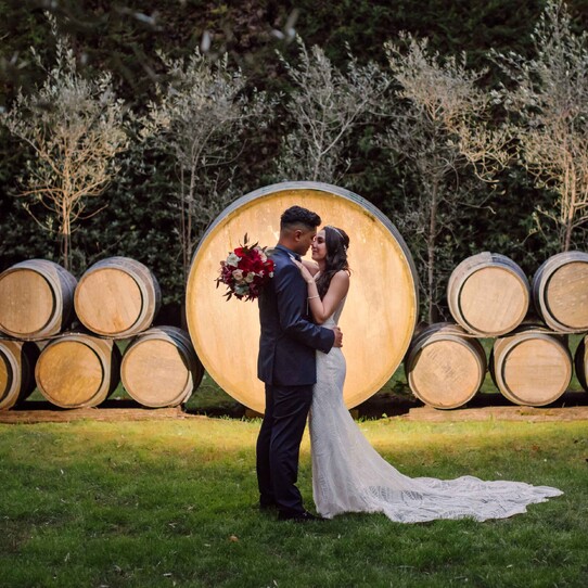 Couple infront of Barrel Feature