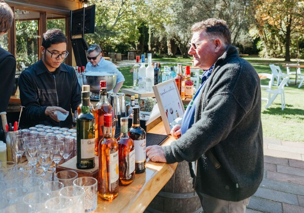 guest standing at a bar table