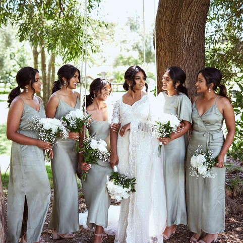 Bride and bridesmaid posing