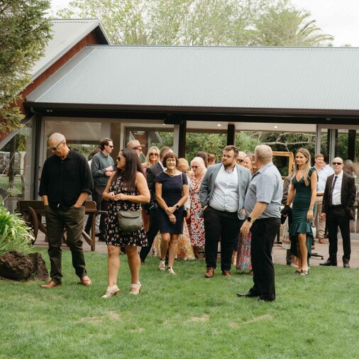 guests standing at Markovina's lawn