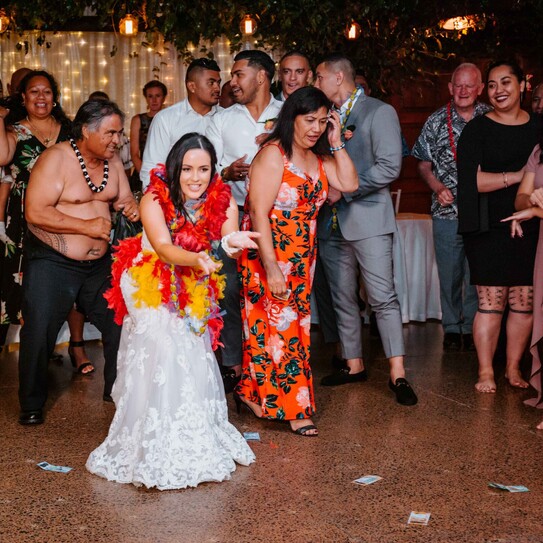 bride and wedding guests playing game