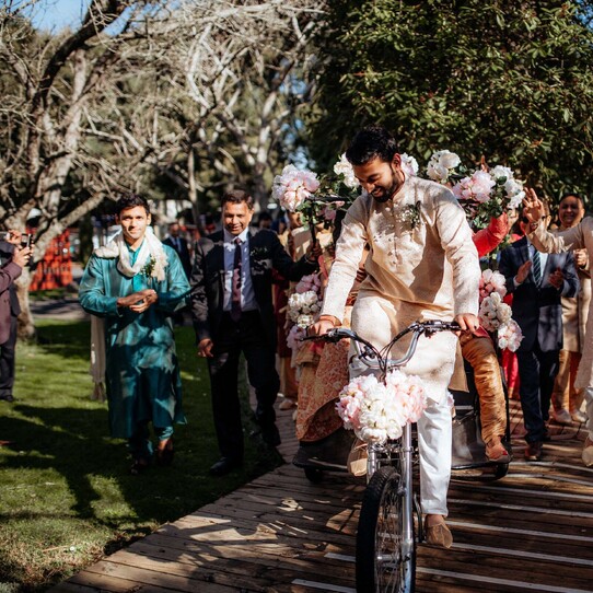 Groom on Bicycle for Baraat Entrance