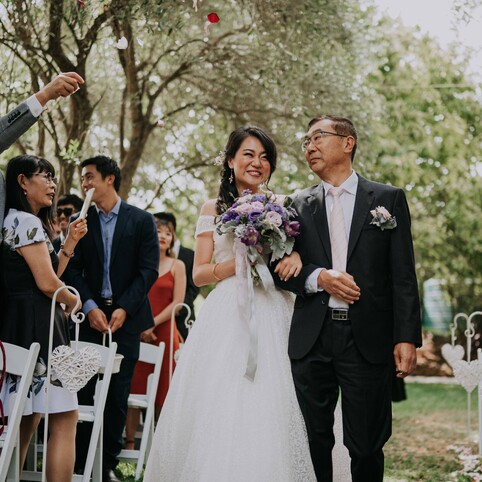 bride walking down the aisle with father
