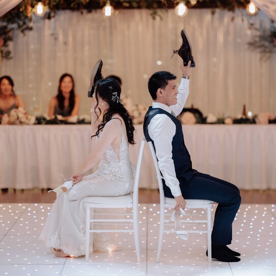 wedding couple playing shoe games