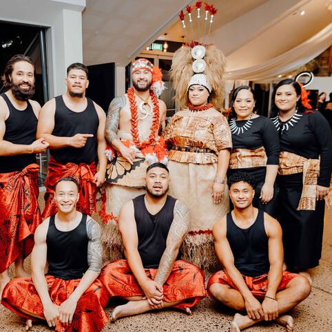 bride and groom posing in traditional clothing