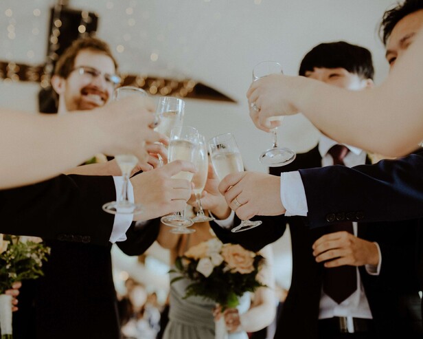 people toasting with champagne glass