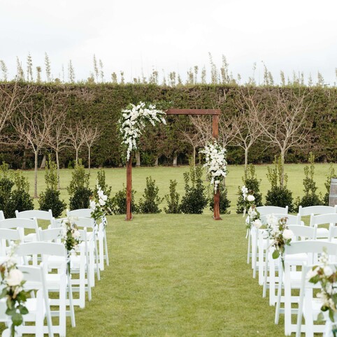 outdoor ceremony set up with arch
