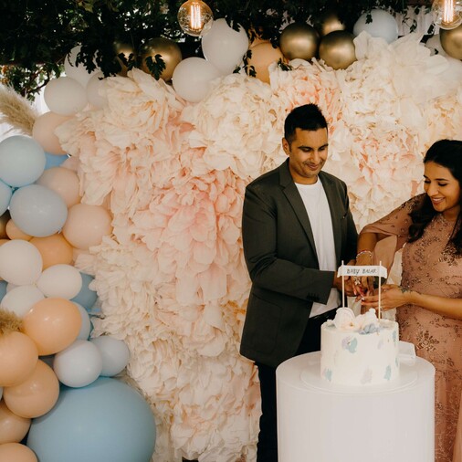 couple cutting cake to reveal baby's gender
