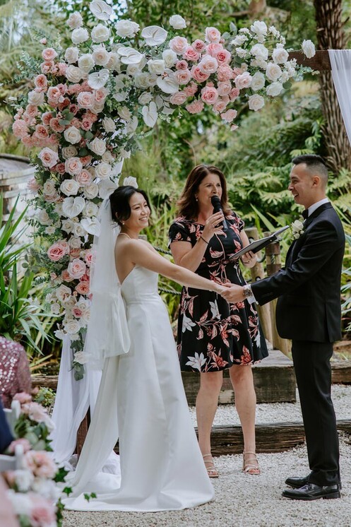 celebrant talking to wedding couple 