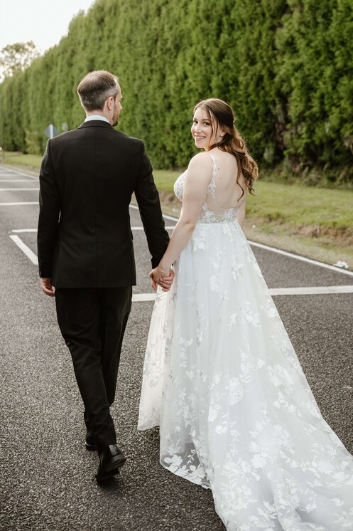 wedding couple walking and posing on the road