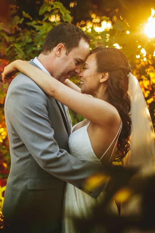 wedding couple holding each other and posing 