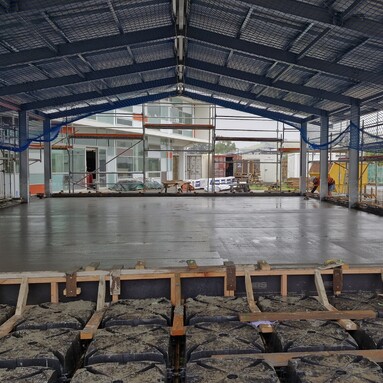 Freshly laid smooth concrete floor of a warehouse