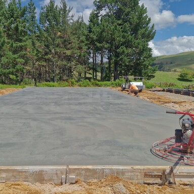 Outdoor concrete flooring with concrete power float on the corner of the slab