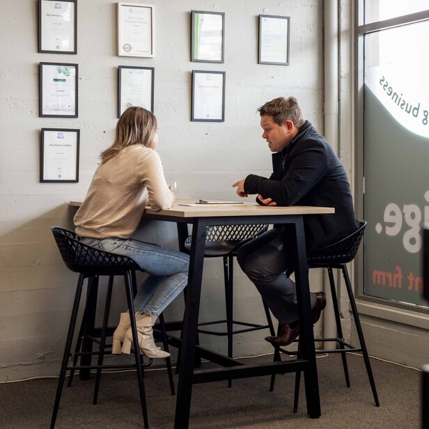Business owner and Insurance Adviser sitting down to chat about business insurance