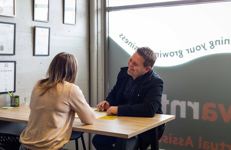 Insurance Adviser and Business Owner sitting down to chat about Business Insurances