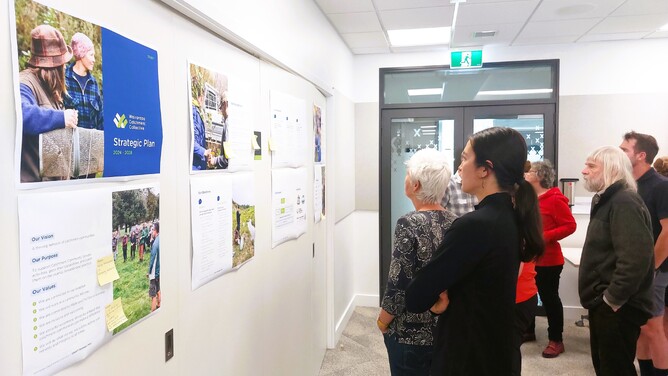 Attendees viewing the strategic plan for feedback at the Wairarapa Catchment Collective Wnanaga